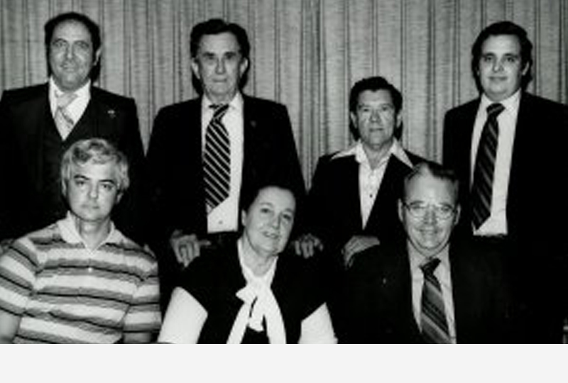 Seated, L-R: Nathaniel F. Belloni, Jr., Secretary; "Lou" Bertaut Douglass; & Dr. Charles E. Nolan, President.  Standing, L-R: Everette F. Gauthreaux, Society Attorney; Bernard Eble, Sr.; Frank J. Ehret, Jr.; & Craig A. Bauer, Vice President.